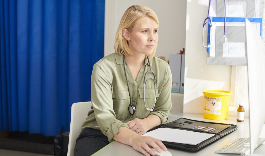 female gp checking her medical records